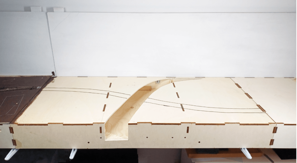 Modifying a model railway baseboard to create a riverbed