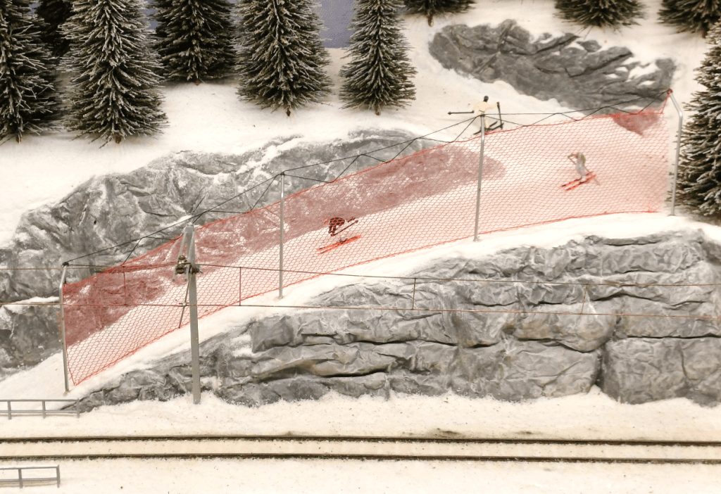Detail of skiers on Swiss Kreuzweg model railway layout
