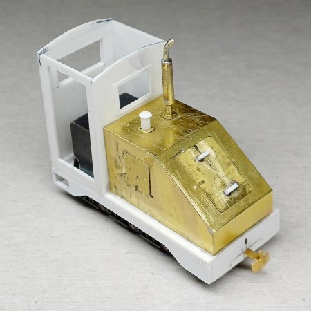 Assembling the brass and plasticard components on a model railway locomotive