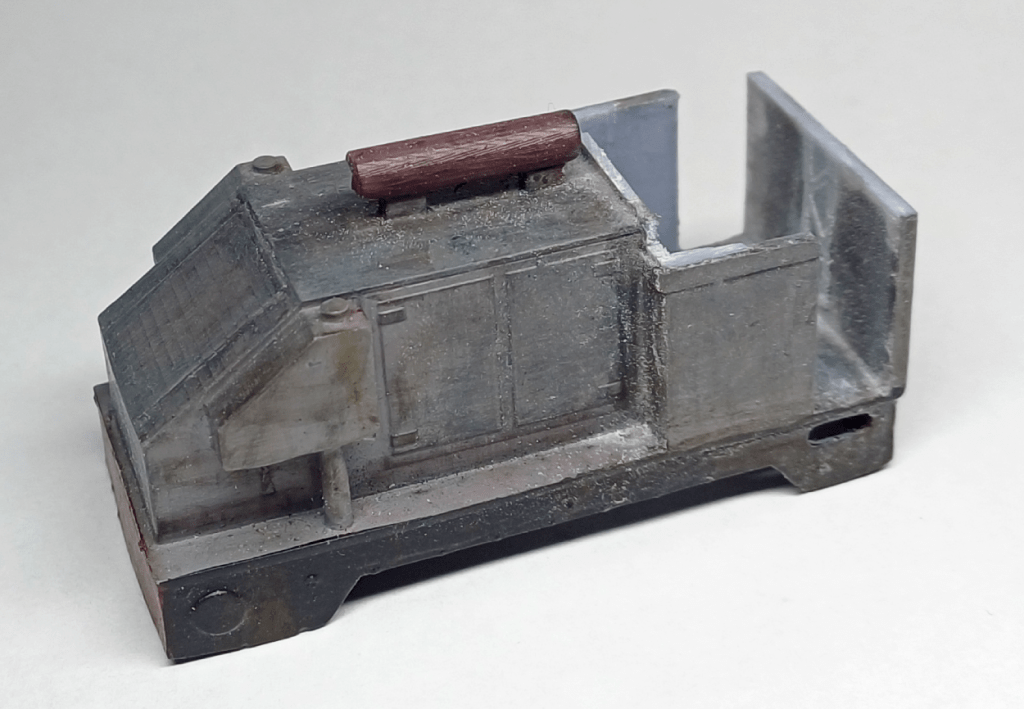 Removing the cab of a 3D printed locomotive body.