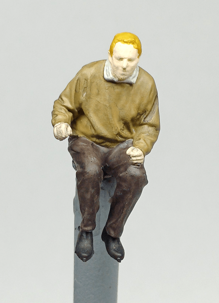 Painted model railway locomotive driver