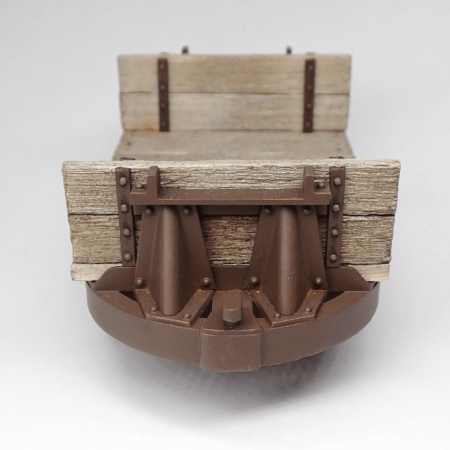 A 16mm scale narrow gauge model railway bulkhead wagon made from a Hudson tipper chassis with end supports.